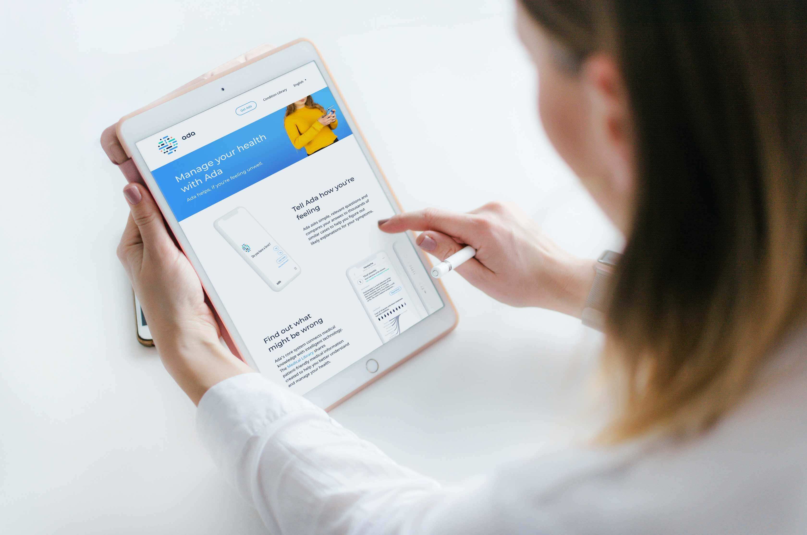 Woman holding a tablet to visit the Ada health website